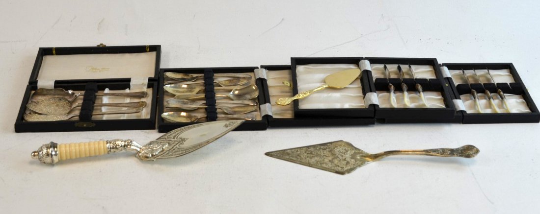 Silverplate Lot Including Mother of Pearl Handles: Silverplate lot including three serving utensils, set of seven spoons, three demitasse spoons, six serving knives, twelve forks, and six knives with mother of pearl handle. Some marked Sheffield Engla