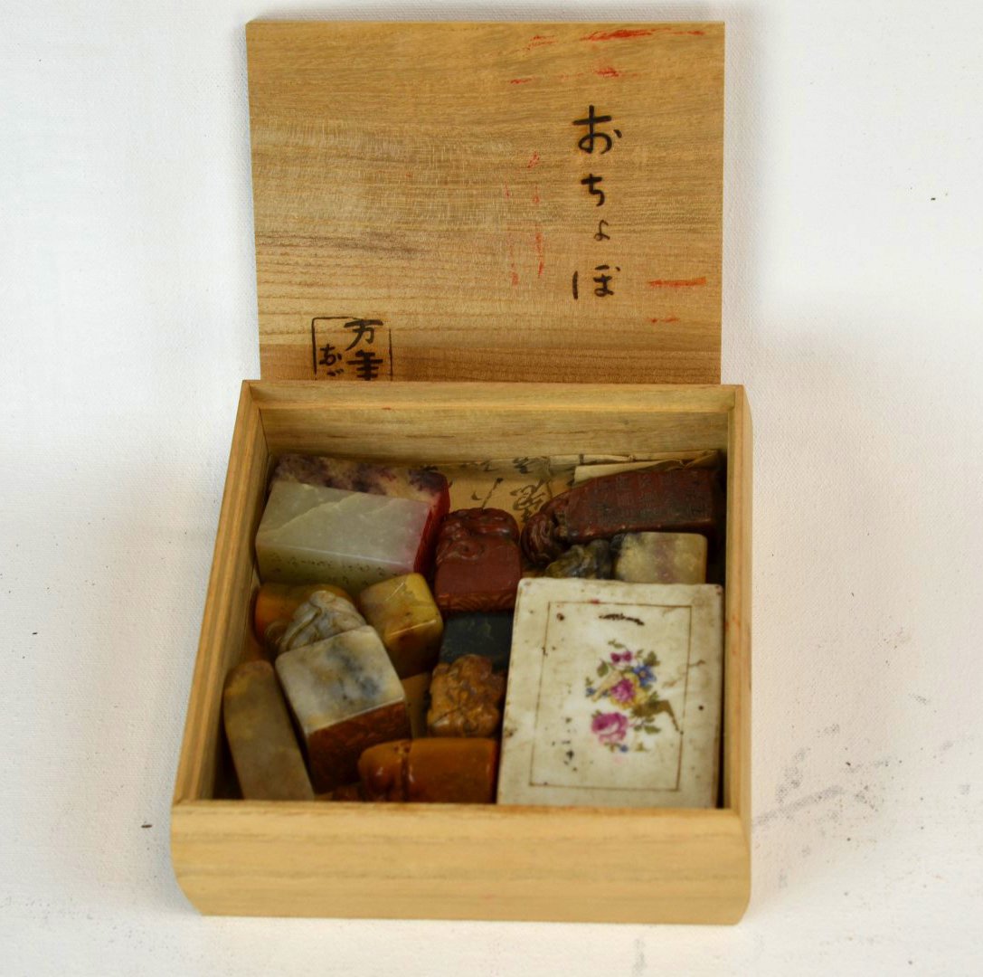 Chinese ink box and 12 soapstone stamps: Chinese ink box and 12 soapstone stamps. Each stamp is a uniquely shaped carved figure. Each stamp is approximately 2'' in height.