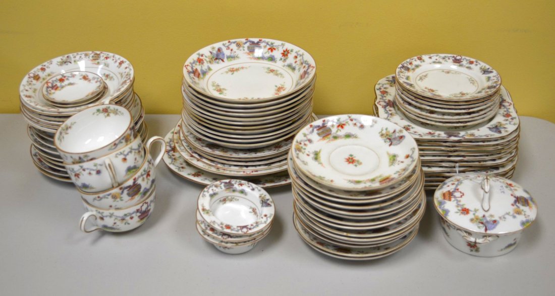 Royal Worcester 72-pc Porcelain Dinner Set: Seventy-two pieces of Royal Worcester porcelain decorated with butterflies and baskets, including three small dishes, twenty-three saucers, eleven lunch plates, eleven bowls, three plates, two soup bo