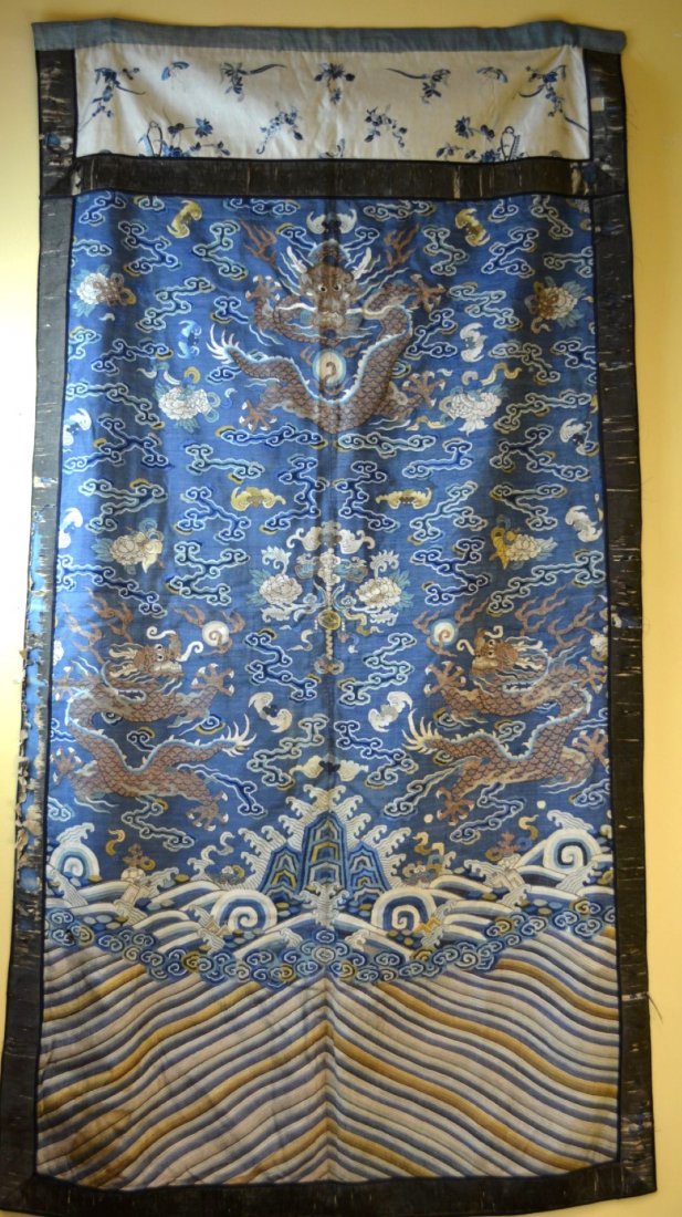 Panel of silk fabric from Chinese governor's robe: Panel of silk fabric from Chinese governor's robe with dragons and bats flying amongst clouds, over crashing waves. 58'' x 32''