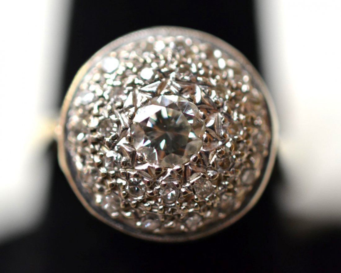 Vintage Diamond Ring: Diamond ring with 40 point center, a 35 point single cut diamond graded VS1 clarity, and G-H color, on 14k white gold band. Marked 14K. 3 dwt (9.7 gs.) Ring Size: 6 1/2"