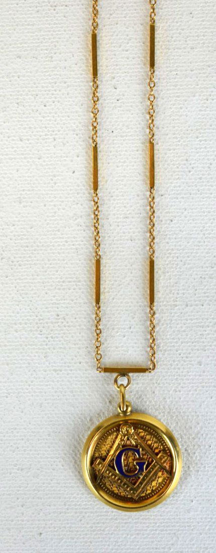 14K Yellow Gold Union Pendant & Chain: 14 Yellow gold pendant with union logo on one side, and engraved with initials on the other, hanging on a 14k chain. 6.4 dwt. (10 gs). Chain marked 14K. Pendant: 3/4'' dia.