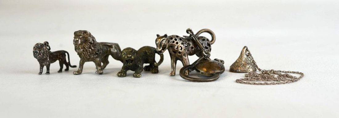 Five Assorted Silver Pieces, Some Sterling: Five silver pieces, some sterling, including four wildcat figures, one of which is fitted with a keychain, the other a Hershey's Kiss necklace. Two marked Mexico, 950, 800, kiss marked STERLING.
