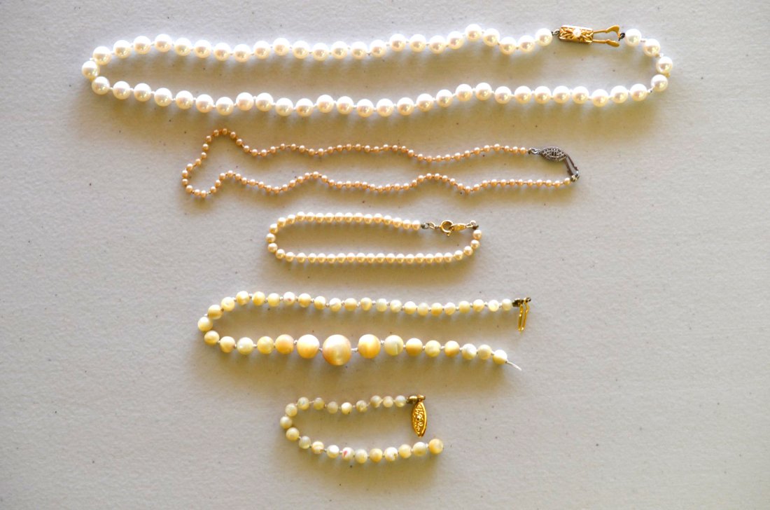 Four Pearl Necklaces or Bracelets: Four pieces; two pearl necklaces, one pearl bracelet, and a beaded stone bracelet in ivory. One marked 14k on gold clasp. Longest: 18''
