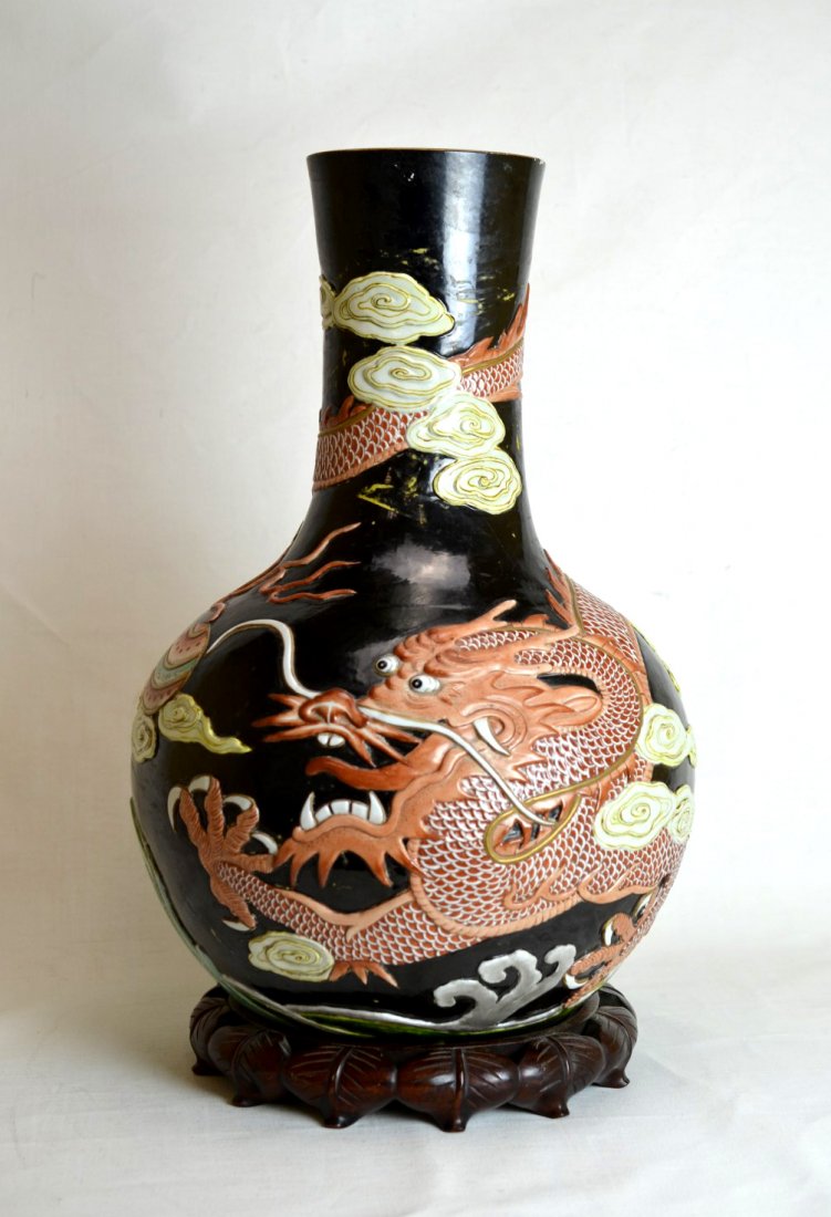 Chinese Porcelain Large Pear Shaped Vase: Chinese porcelain large pear shaped vase decorated with an image of a five-finger dragon among clouds against a black background. Contains six character impressed seal mark. One hairline crack to the 