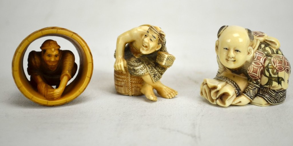 Three Japanese Antique Ivory Netsukes: Three antique ivory netsukes; two of barrel makers and one of a boy on a bag. All marked. 19th century. Dimensions: Biggest height - 1 1/2" Smallest height - 1 1/8" 19th century
