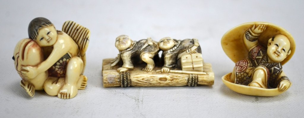Three Japanese Antique Ivory Netsukes: Three antique ivory netsukes; one of a boy in clam, another boy and fish, and two blind men on a raft. All marked. 19th century. Dimensions: Biggest height - 1 3/8" Smallest height - 7/8" length - 2"