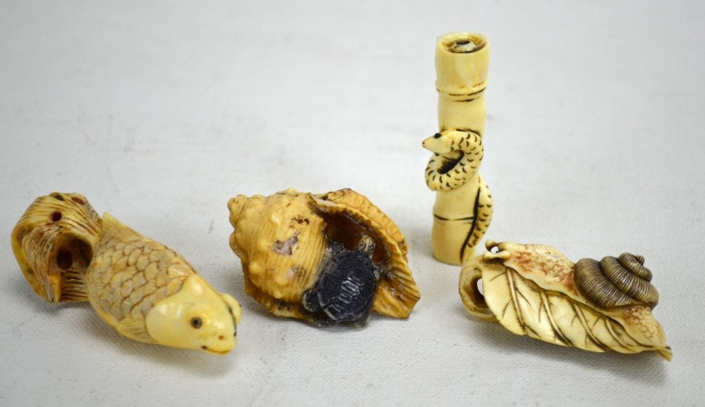 Four Japanese Antique Ivory Animal Netsukes: Four antique ivory animal netuskes; animals include a fish, snail, turtle, and a carp. All marked. 19th century. Dimensions: Biggest height - 2 3/8" Smallest height - 3/4" length - 2 1/4"