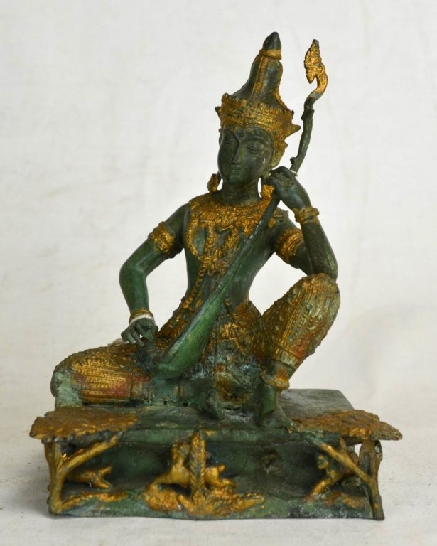 Thai Bronze Carving of Sitar Player: A Thai bronze carving of a sitar player with gold accents. Height - 7" Length - 5 5/8" 19th/20th century