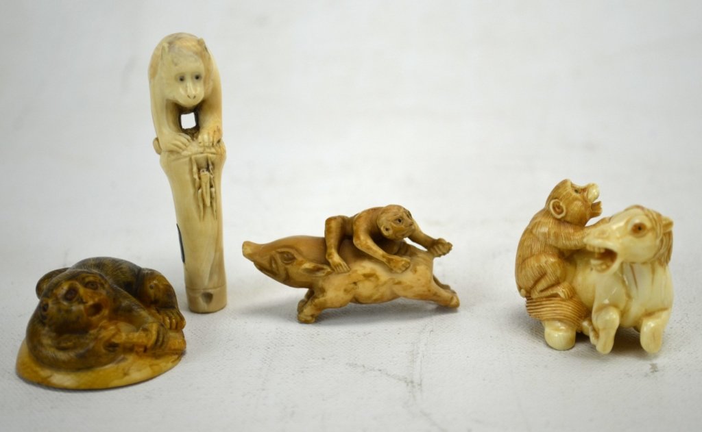 Four Japanese Antique Ivory Netsukes of Monkeys: Four antique ivory netsukes carved into monkeys with other animals. A monkey atop a bamboo stump with a grasshopper. A monkey on a horse. A monkey on a clamshell with an octopus, and a monkey riding a