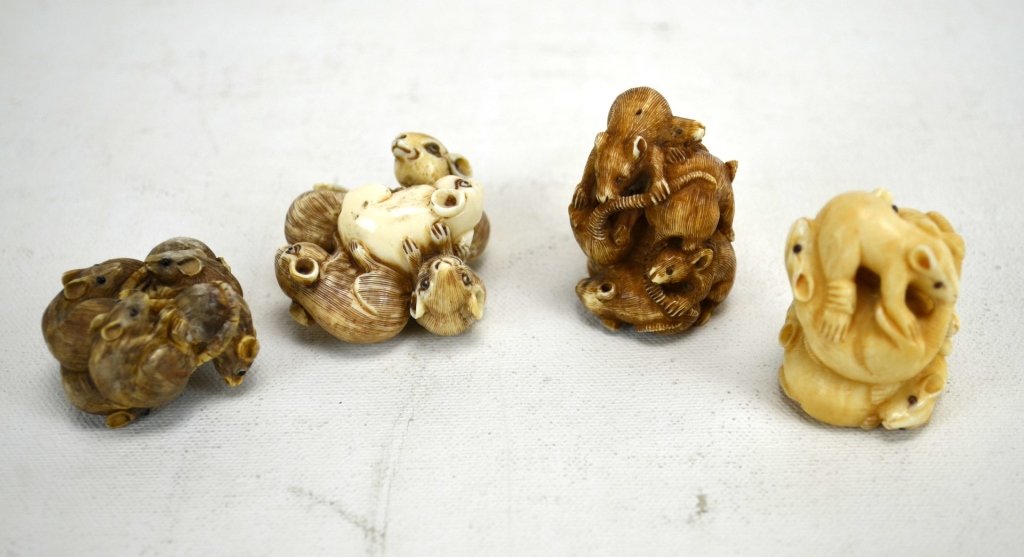 Four Japanese Antique Ivory Netsukes of Rats: Four antique ivory netsukes; each carved into a ball of rats. All marked. 19th century. Dimensions: Biggest height - 1 3/4" Smallest height - 7/8"