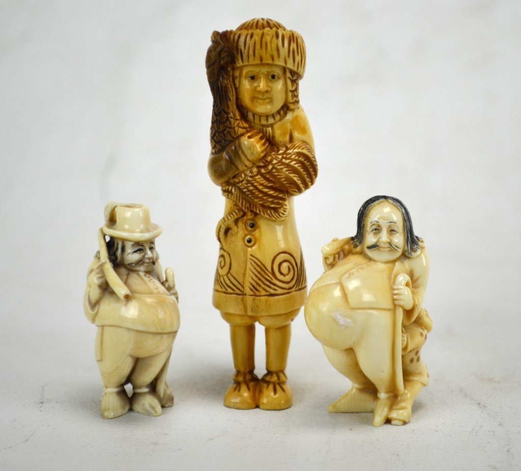 Three Japanese Antique Ivory Dutchman Netsukes: Three antique ivory Dutchman netsukes; two of Dutchmen with large pot belly and boy holding on to legs (unmarked), the other a standing Dutchman with a chicken (marked). 19th century. Dimensions: Bigg