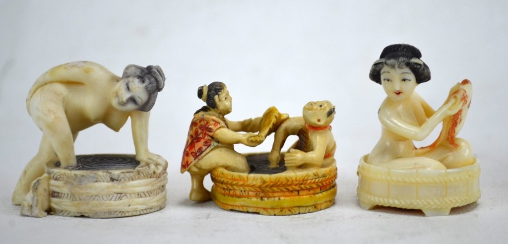 Three Antique Ivory Netsuke of Bathing Women: Three Japanese antique ivory netsukes; a woman taking a bath, woman getting into a bath, and a woman bathing with her child. All marked. 19th century. Dimensions: Biggest height - 1 3/4" Smallest heig