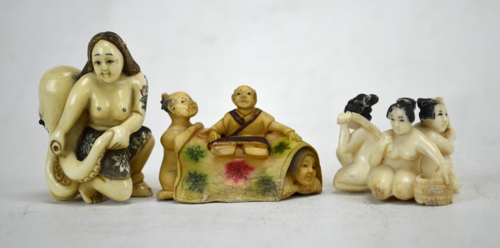 Three Japanese Erotic Ivory Netsukes: Three erotic ivory netsuke carvings; a woman with an octopus (marked), erotic man & woman under the blanket (marked), and 3 naked women bathing together (not marked). 19th century. Dimensions: Biggest