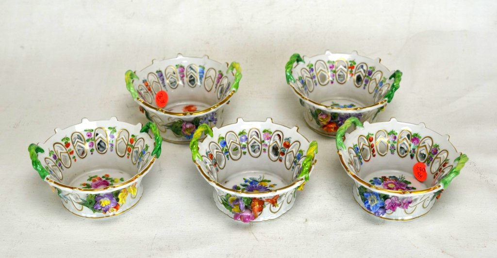 Five Dresden Porcelain Baskets: Five Dresden porcelain reticulated baskets. Each with molded flowers, handpainted flowers, and two green hand painted handles. All with Dresden underglaze blue mark.