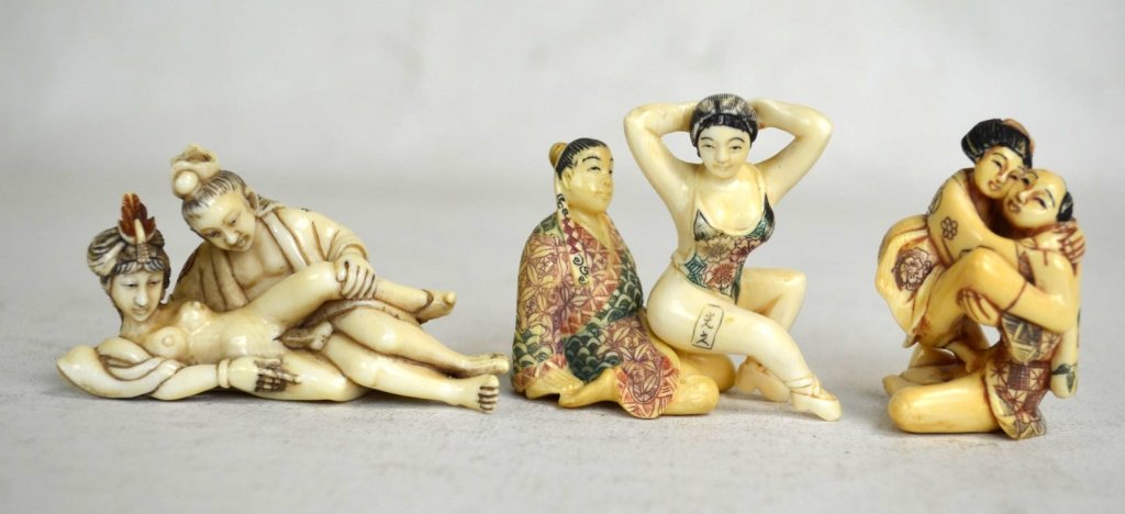 Three Japanese Antique Bone Carvings: Three antique bone carvings of erotic scenes; 1 one carving of man and woman, and one is 2 pieces of erotic scene of man and woman. All three are signed. Tallest 2 1/4"