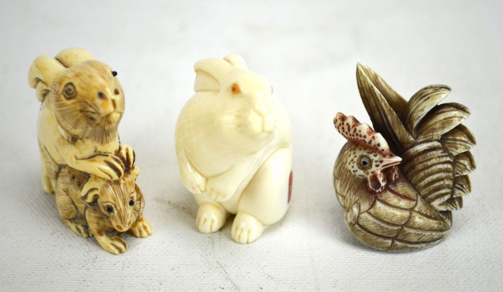 Three Japanese Antique Animal Netsukes: Three antique netsukes carved into animals; two of rabbits (both marked) and one of a chicken (unmarked). 19th century. Dimensions: Biggest height - 1 3/4" Smallest height - 1 1/2" 19th century