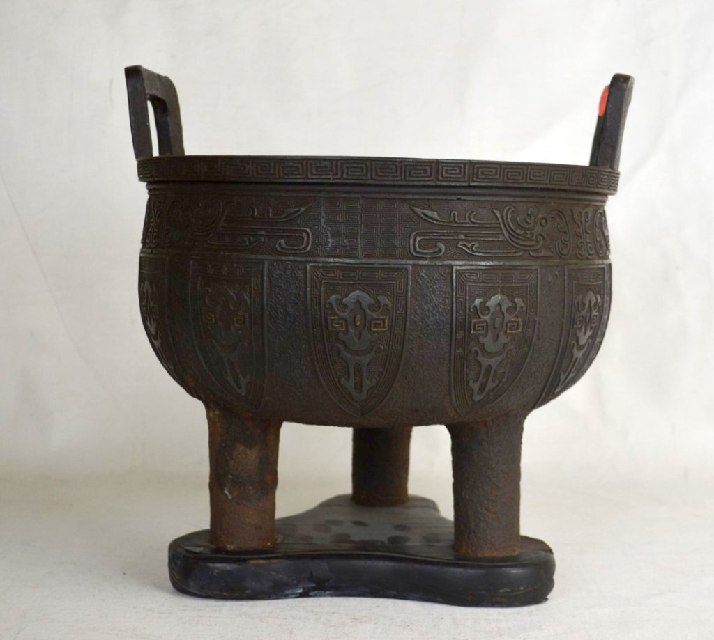 Chinese Cast Iron Censor: Chinese cast iron censor with wooden base; carved on exterior with Greek key and other designs. Height - 11 3/4", Diameter - 11 1/4" 19/20th Century