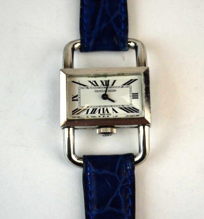 Jaeger LeCoultre Ladies Watch: Jaeger Le Coultre ladies wristwatch with blue leather band and stainless face, Swiss made. Face: 3/4" x 5/8"