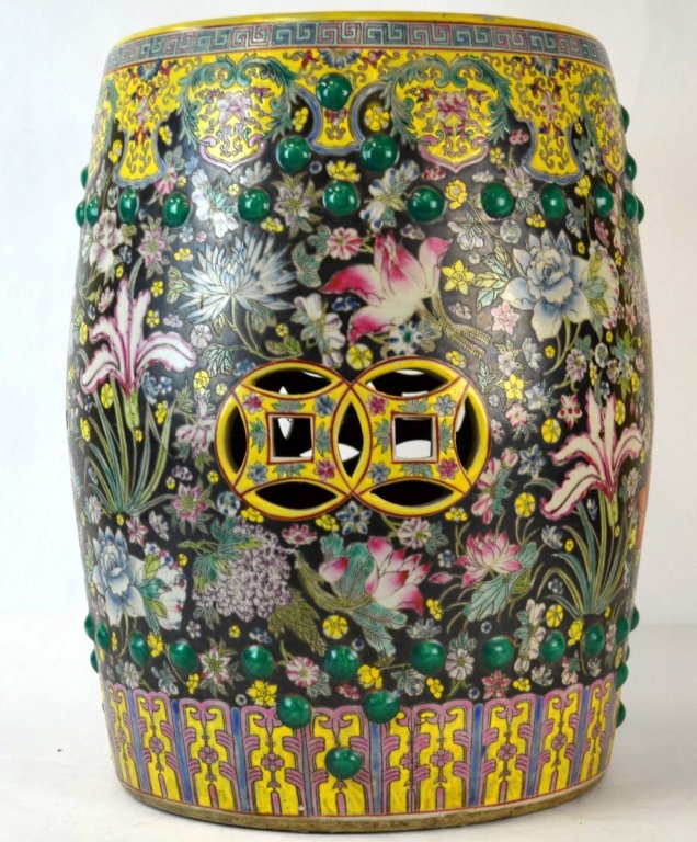 Chinese Porcelain Famille Rose Floral Garden Stool: Chinese porcelain Famille Rose garden stool with allover colorful floral design and green "jeweled" accents. 17" x 12"