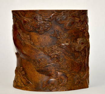 Chinese Finely Carved Chenxiang Wood Brush Pot: Qing Dynasty. Chinese carved Chenxiang wood brush pot decorated with trees and animals along a mountainside. 6" x 6 1/2" x 5 1/2"