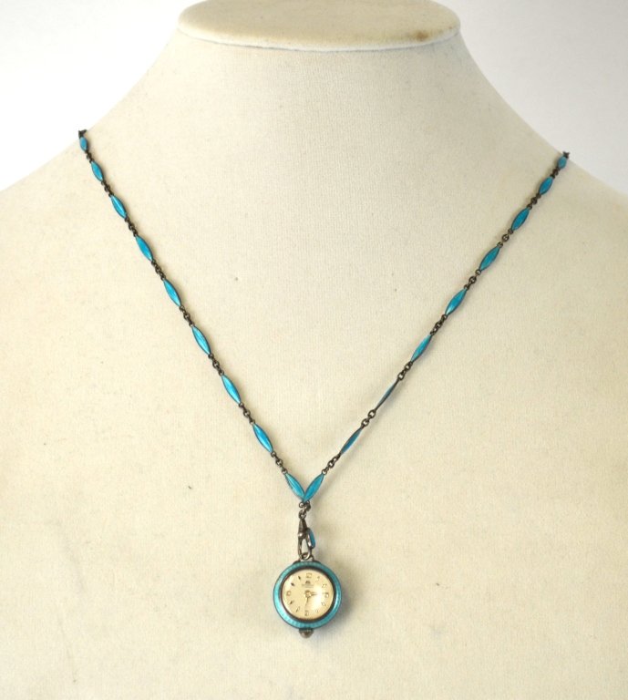 Bucherer Silver & Turquoise Enamel Watch w Chain: Bucherer turquoise blue enamel & sterling silver watch pendant with chain. Marked 17 jewels on the face. Hanging length 15" , watch face 20mm dia.