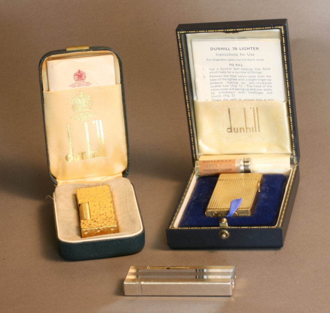 Two Dunhill lighters. With cases and papers. And a: Two Dunhill lighters. With cases and papers. And a Denis lighter. Property of a Lady, London.