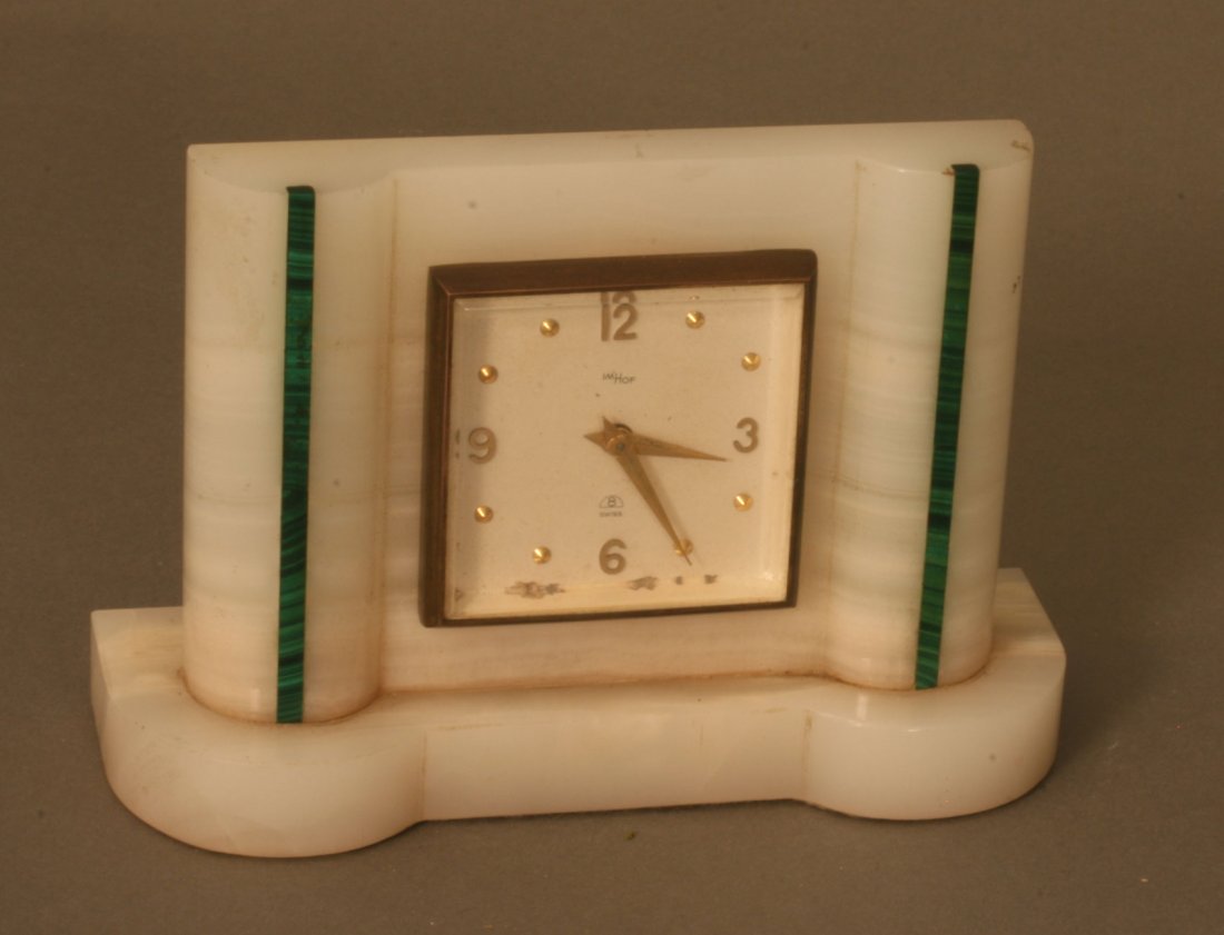 A Swiss Art Deco Onyx and Malachite Time Piece: A Swiss Art Deco Onyx and Malachite Lady's Dressing Table Time Piece. The movement backplate signed Swiss lever escapement C 224, 1083330. 9.8cm high. 14cm wide.