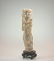 A Carved Ivory Figure of a Robed Lady. Wearing loose