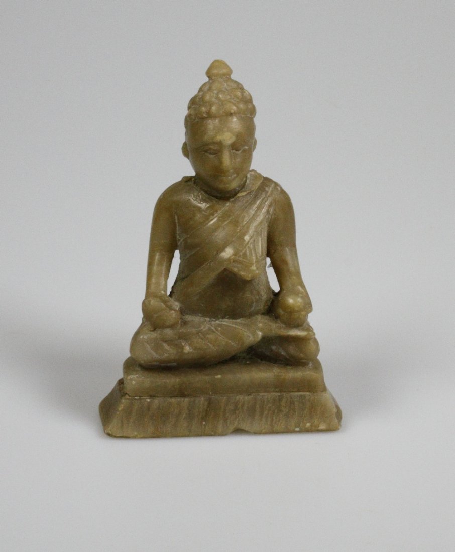 Chinese Soapstone Figure of Buddha: A Chinese Soapstone Figure of Buddha. In typical pose. 10 cm high. 6.3 cm wide at the base. With some chips and scratches.