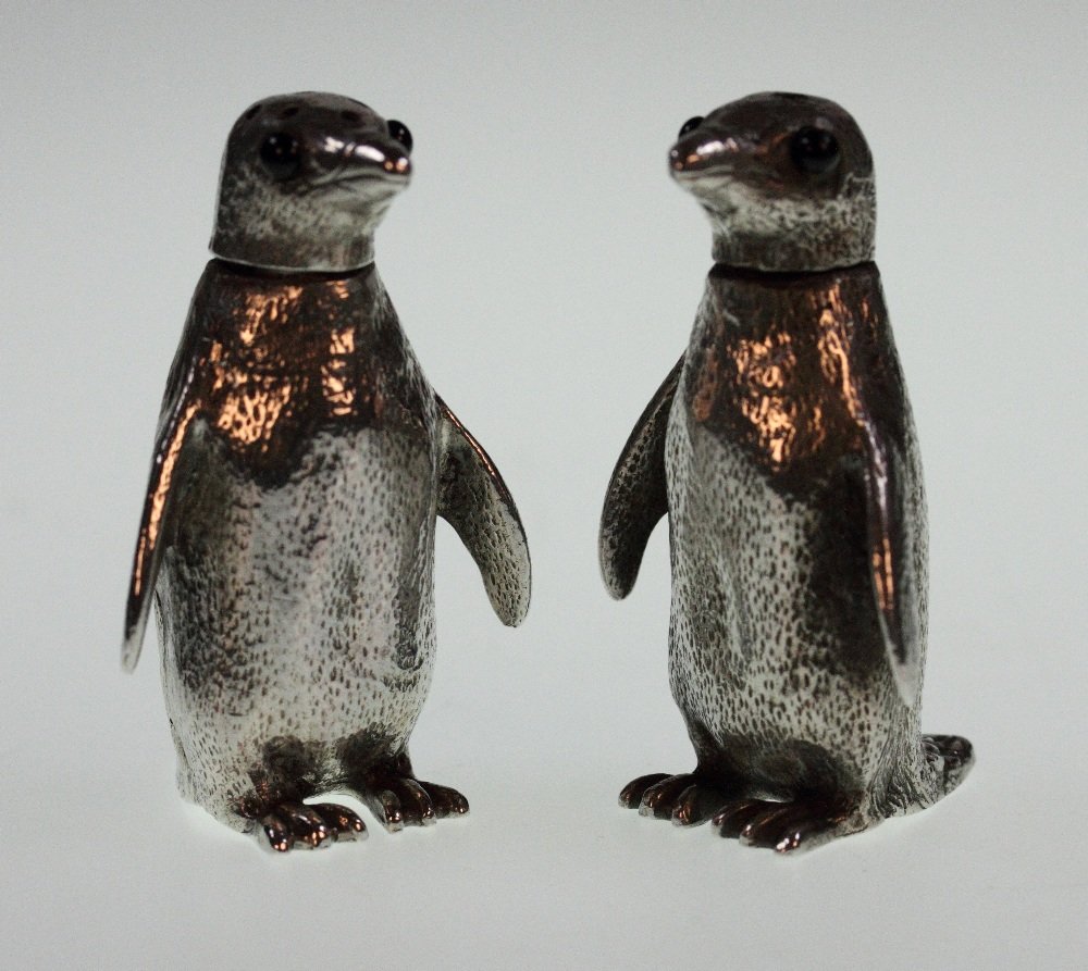Condiments: A Pair of Elizabeth II Cast Silver Novelty Condiments. Richard Comyns. London 1961. Each in the form of a Penguin. with black enamel eyes. 6 cm high. 147.4 grams. 4.73 ounces.