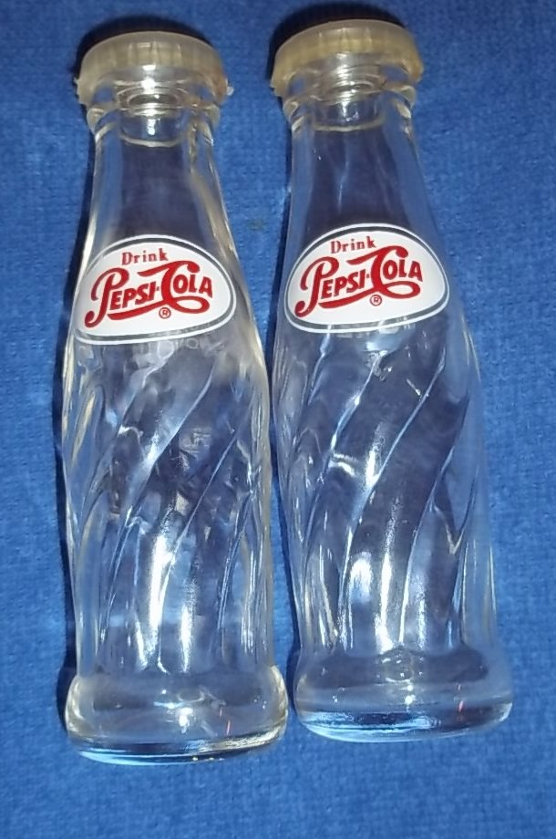 “Drink Pepsi” Salt & Pepper Shakers.Shaped likeBottles: “Drink Pepsi” Salt and Pepper Shakers. Shaped like Pepsi bottles. Measures: 4”H X 1”W