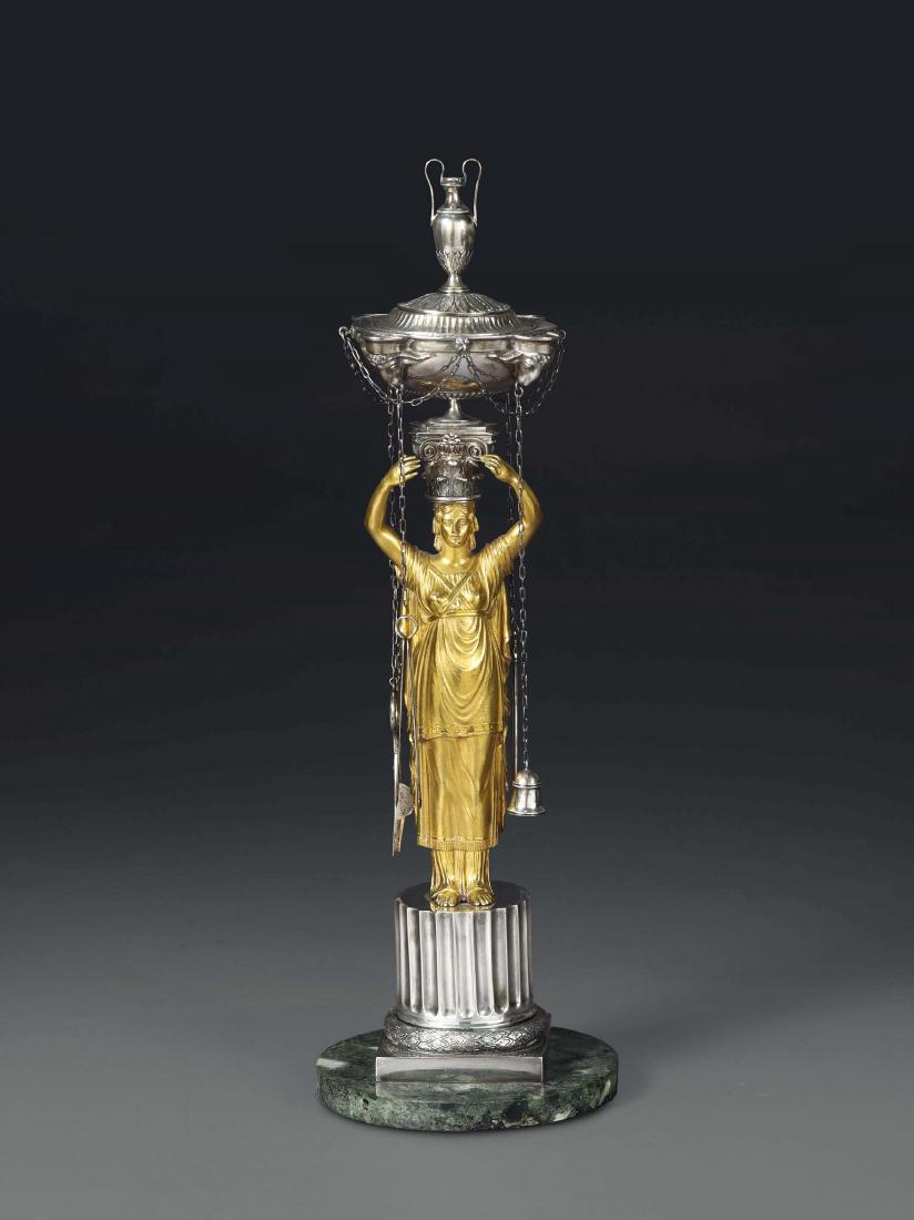 An oil lamp in embossed and chiselled silver, gilt (1 of 4)