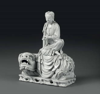 A Guanyin on a dragon in Blanc de Chine porcelain,: altezza cm 26