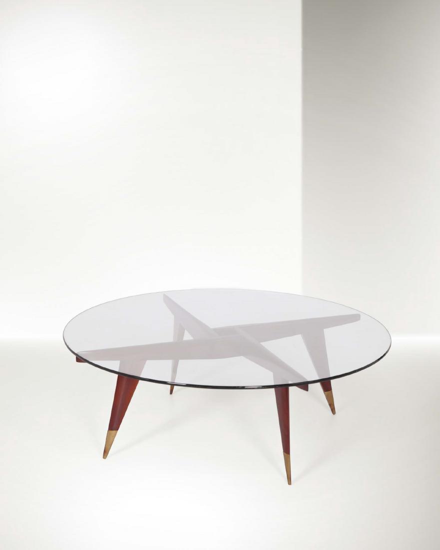 Gio Ponti, a coffee table with a wooden structure and: Tavolo basso con struttura in legno e dettagli in ottone. Piano in cristallo. Certificato originale Gio Ponti Archives. Prod. Giordano Chiesa, Italia, 1953. cm 105x34, Bibliografia U. La Pietra, Gio P