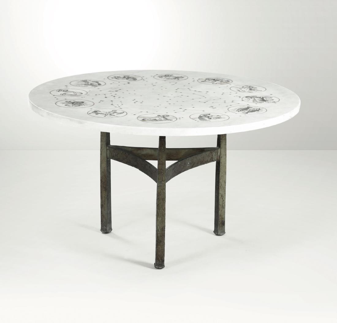 A low table with an iron structure and marble top. (1 of 1)
