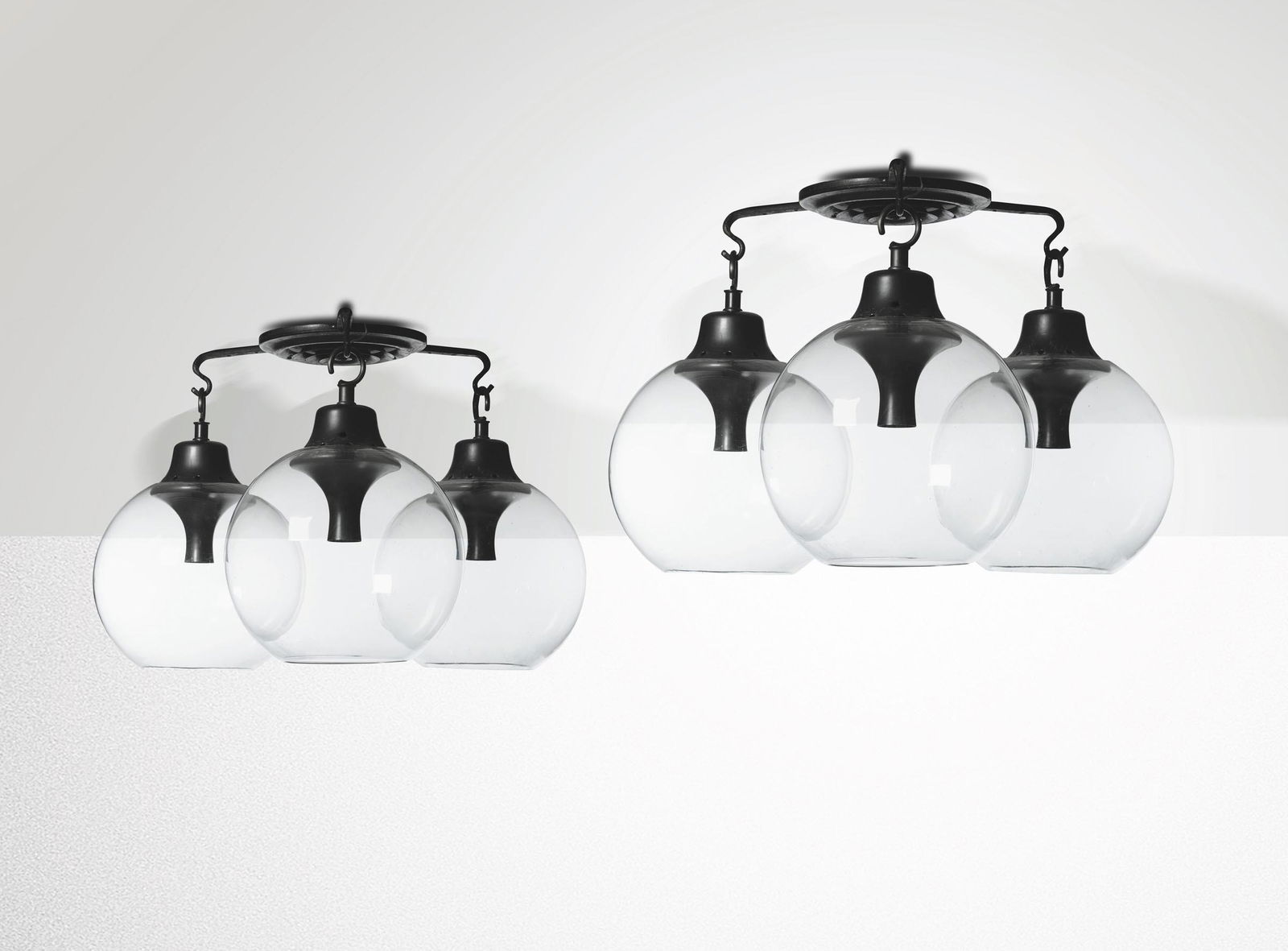 L. Caccia Dominioni, two LS10 Grappolo lamps, 1960s: Lacquered aluminium and blown glass. Original design for the Golf Club House in Monticello. Prod. Azucena. 80x64cm. Bibliography: Catalogo originale; G. Gramigna, Repertorio del design italiano 1950-2