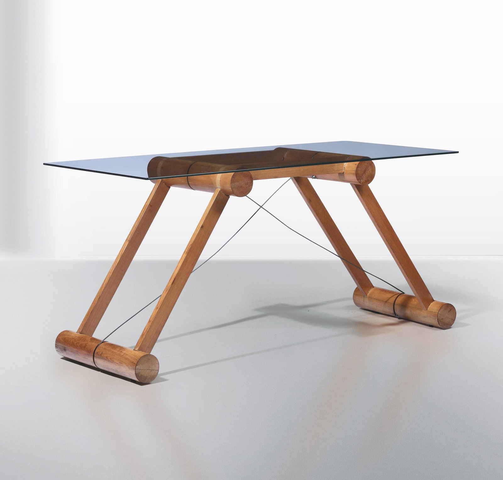 Superstudio, a mod. Teso table, Italy, 1977: Wooden structure, steel tie rods and cut crystal top. Prod. Giovannetti. 165x74x77cm.