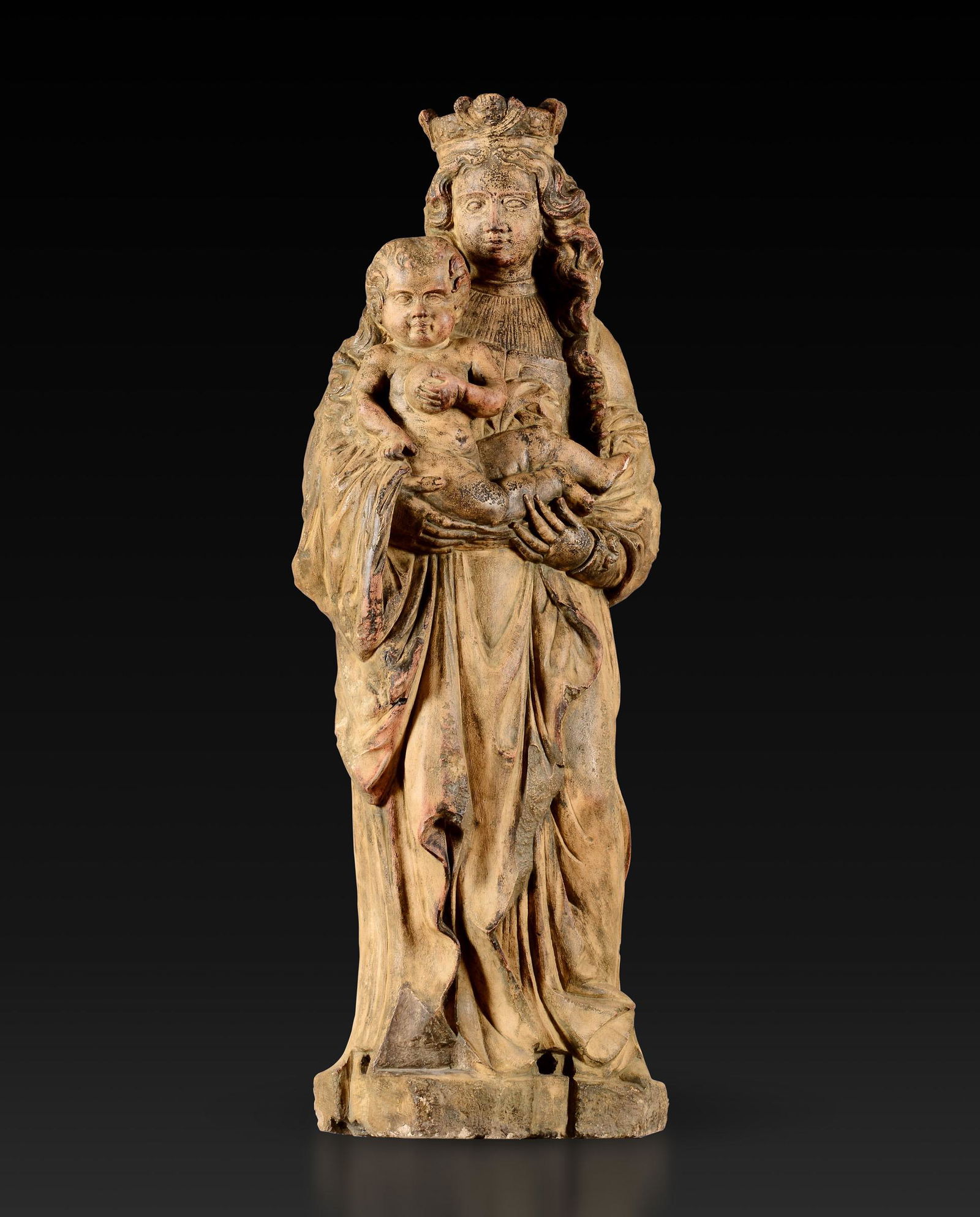 A Madonna with Child, stone, late 15/1600s: Traces of polychromy. 40x20x110cm