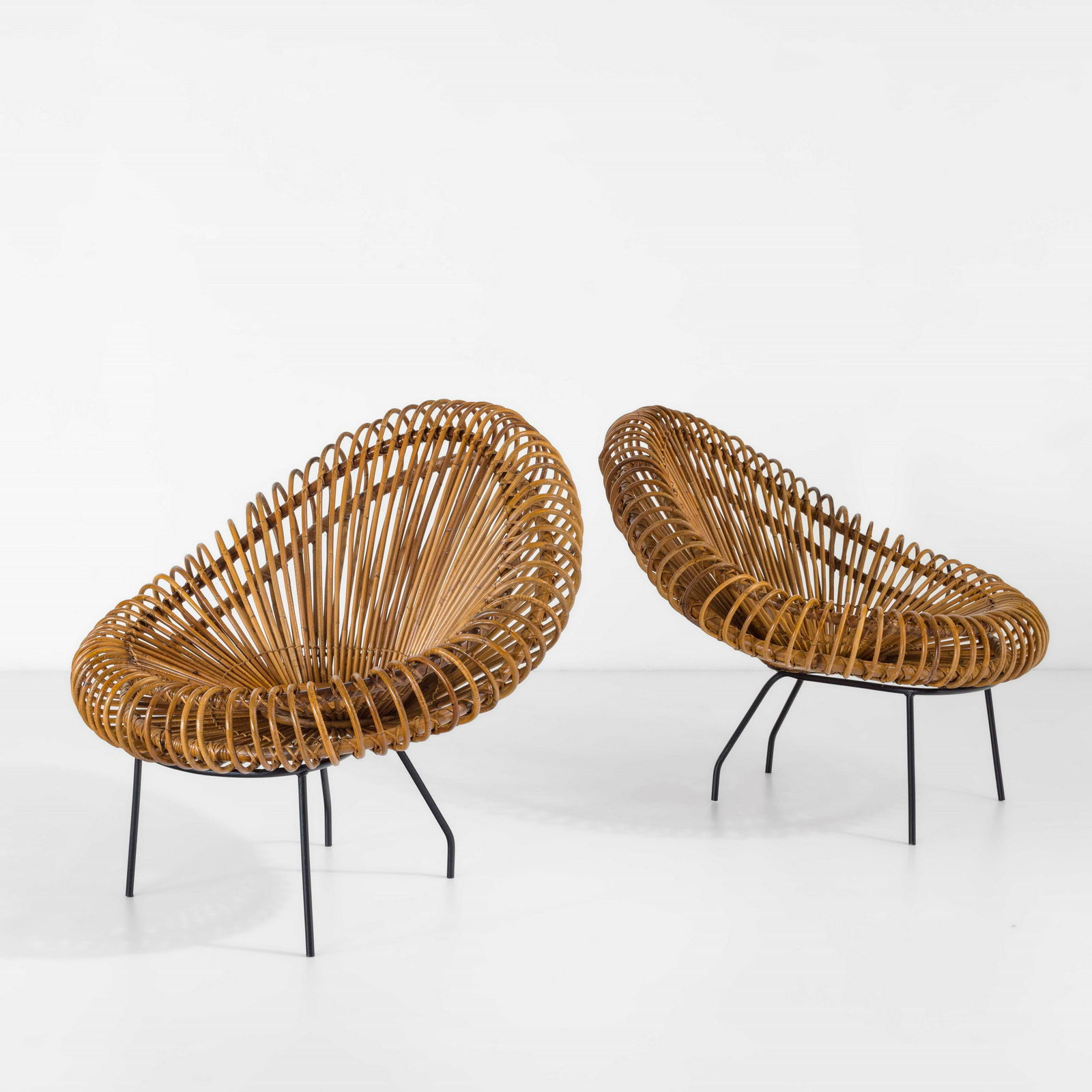 Janine Abraham Due poltrone: Struttura in rattan con sostegni in tondino metallico laccato.¶Prod. Olanda, 1950 ca.