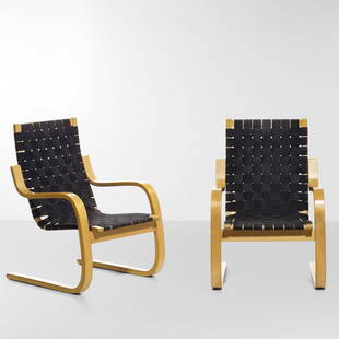 Alvar Aalto Coppia di poltrone mod. 406: Struttura in legno curvato e seduta in tessuto intrecciato. Prod. Artek, Finlandia, 1950 ca.