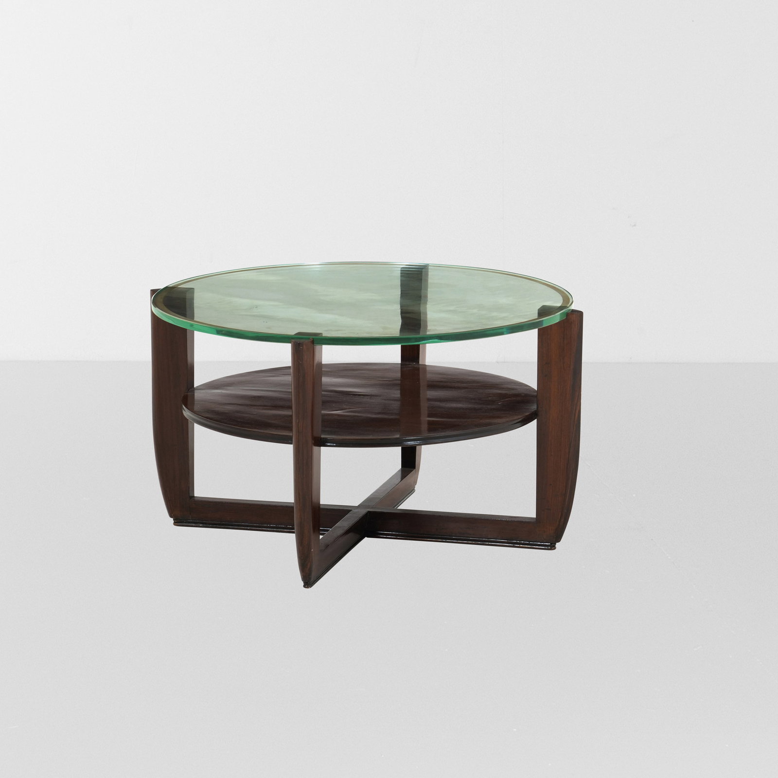 Tavolo basso.: Struttura in legno, piano in cristallo molato di forte spessore.Prod. Italia, 1950 ca.