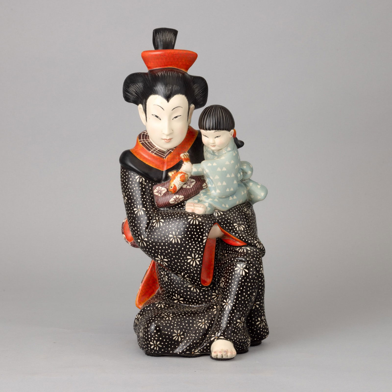 Maternità giapponese Lenci, Turin 1940s: Earthenware figure of mother and son in traditional costumes with polychrome decoration.Manufacturer's mark. A. Panzetta, a cura di, Le ceramiche Lenci. Catalogo dell'archivio storico 1928-1964, Allem