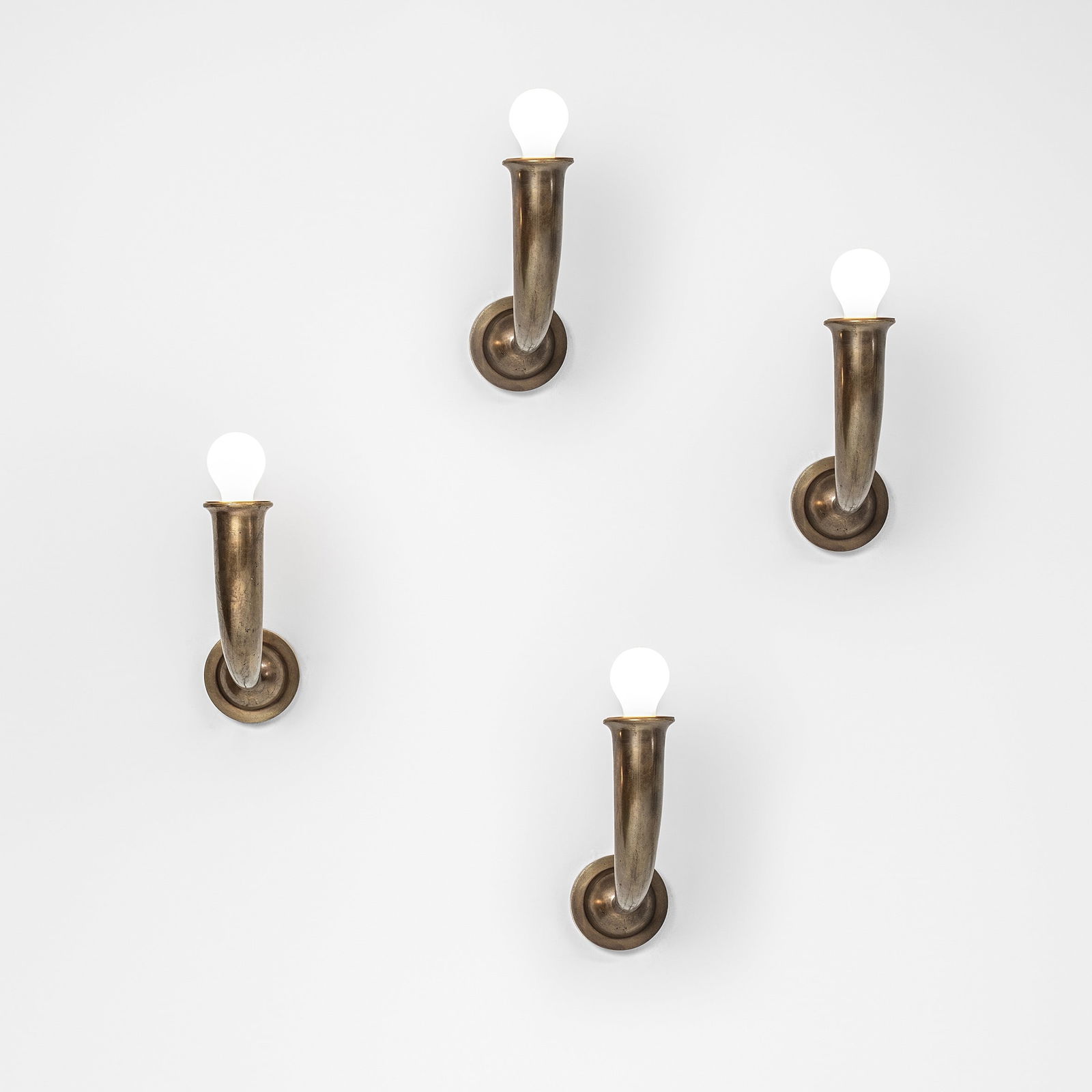 Gio Ponti , attribuito a Four wall lamps.: Cast bronze structure.Italy, c. 1930