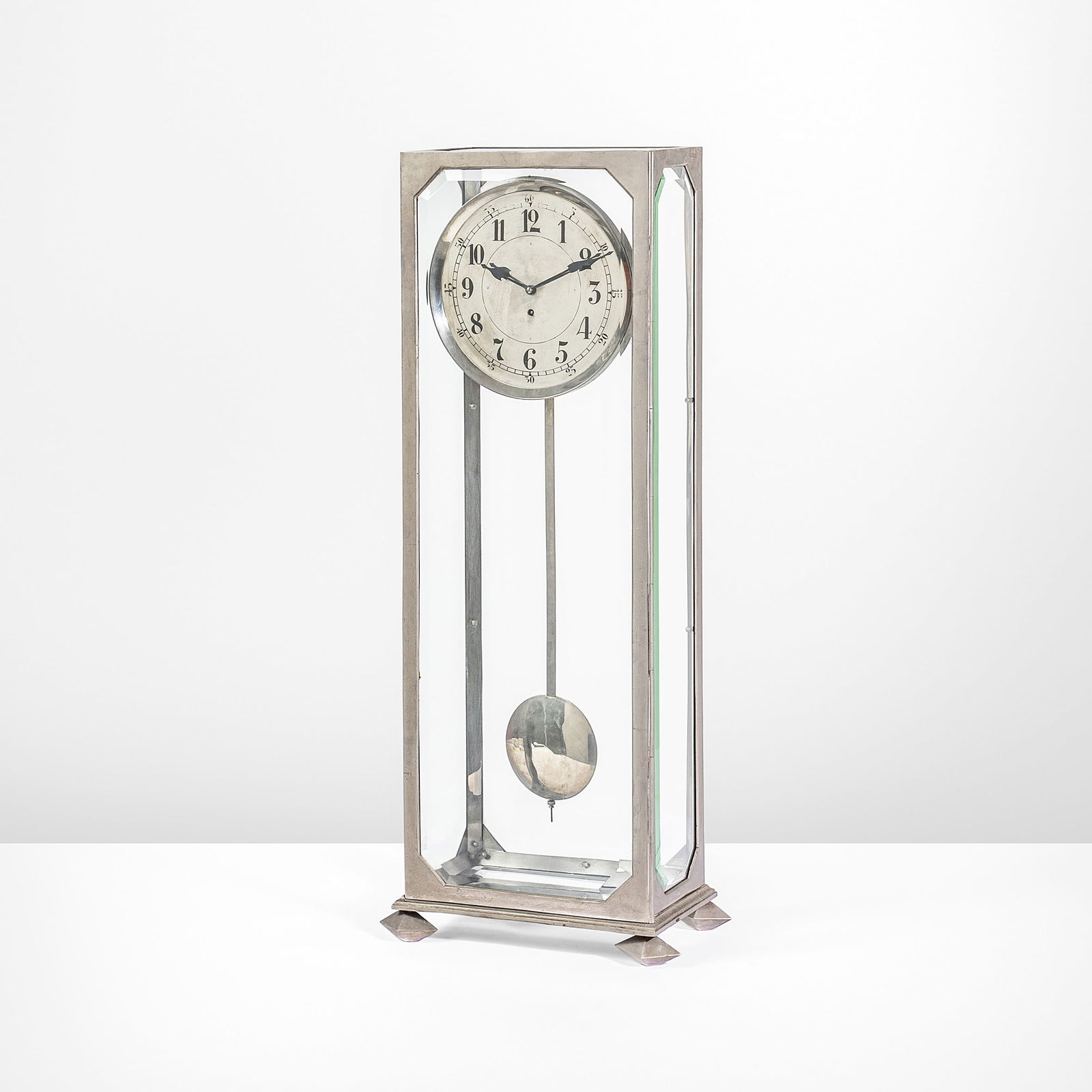 Adolf Loos Rare floor pendulum clock.: Glass and metal frame.From the private collection of Amalia Glanzmann, acquired by the present owner for a private collection - Trieste. Johannes Heeg, Austria, c. 1904. Burkhardt Rukschcio und Roland
