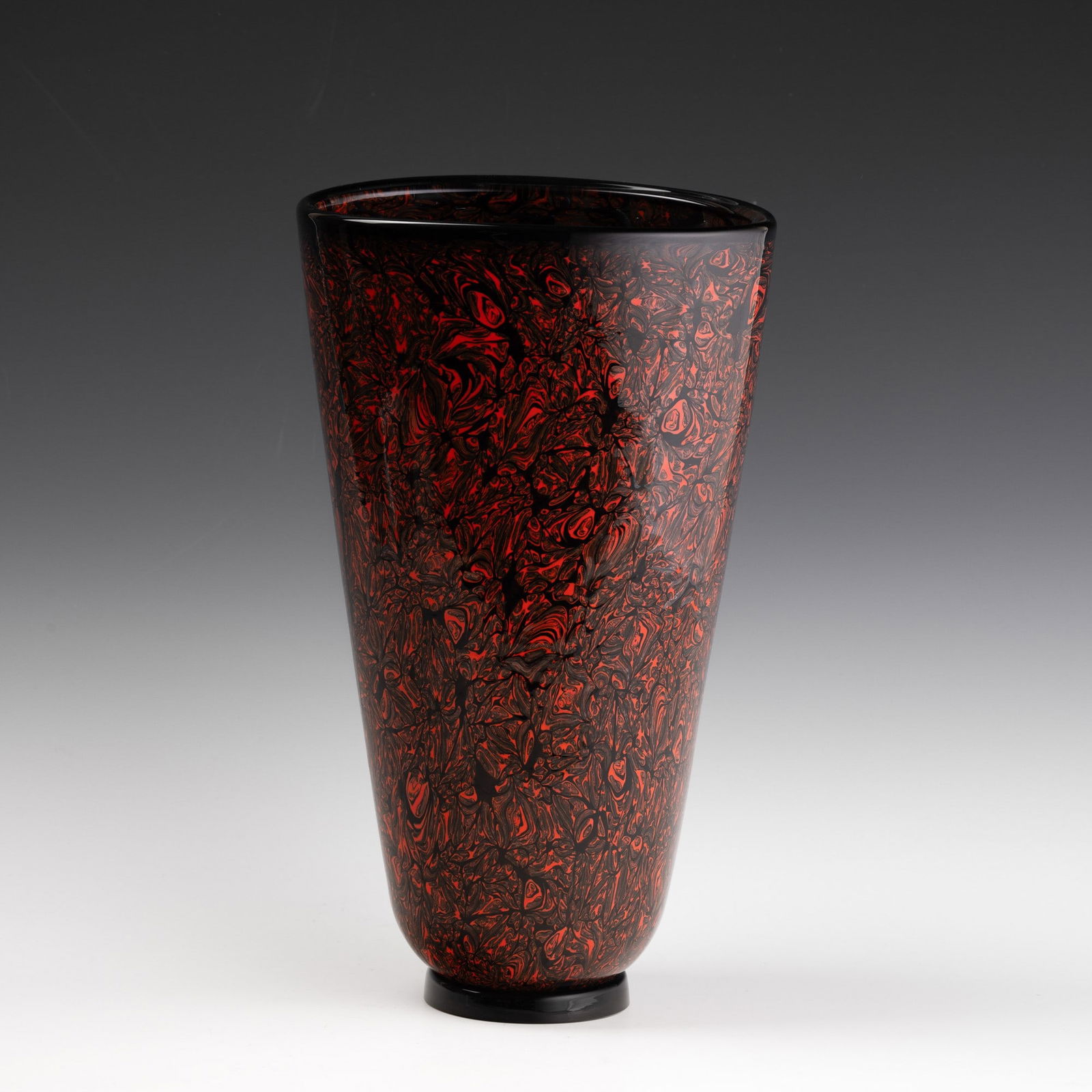 Vittorio Ferro 1932-2012 Vetreria de Majo, Murano, 1990.: Oval section Mosaico series truncated cone vase in sommerso glass decorated with ruby red variegated murrines. Applied round foot.One-off piece by the maestro Vittorio Ferro.Engraved date and signatur