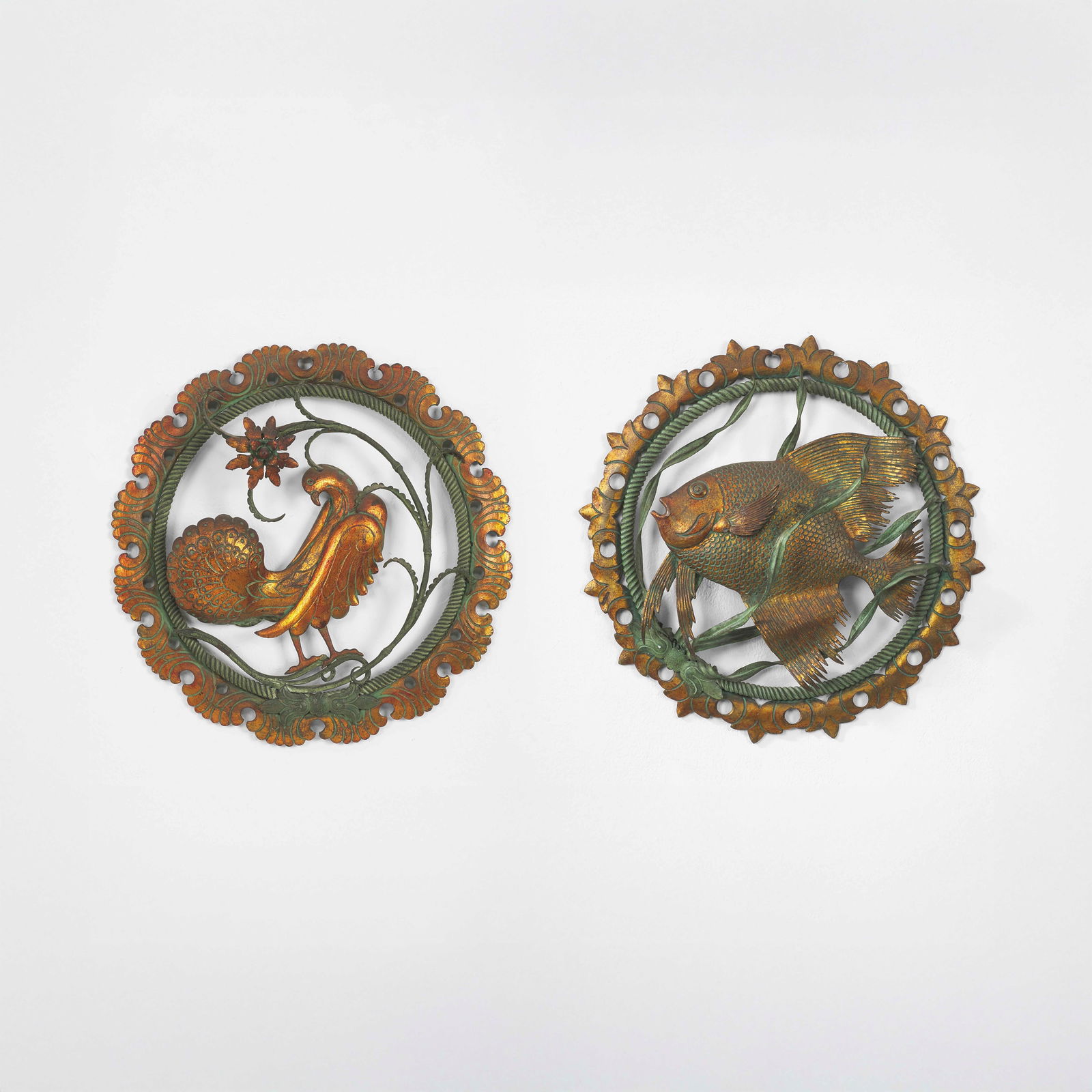 Carlo Rizzarda Two decorative tiles with lapwing and fish.: Wrought iron, engraved, stamped and gilded. From a private collection - Milan. Italy, c. 1922-23. (similar model) G. Marangoni (curated by), Enciclopedia delle moderne arti decorative italiane, Il fer