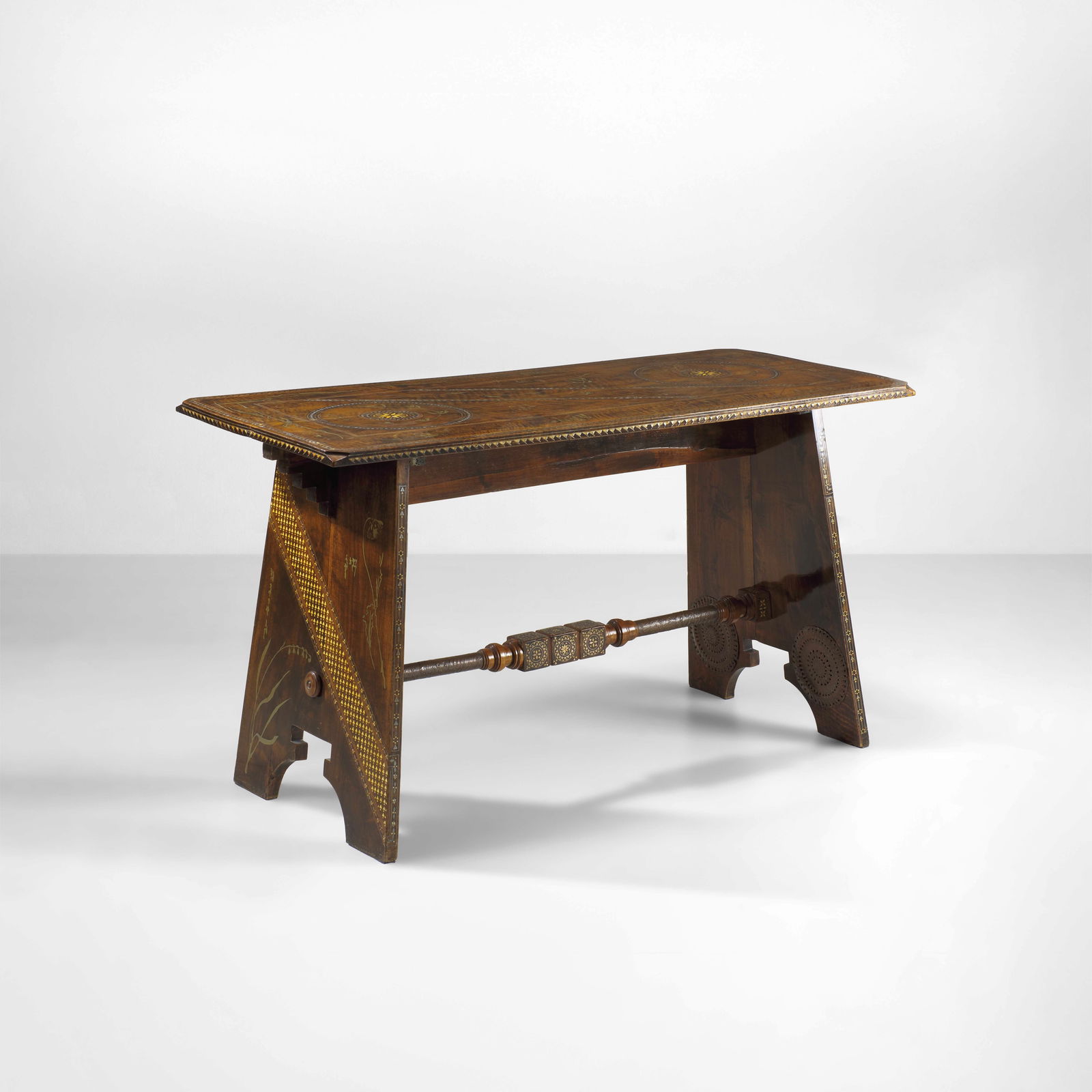 Carlo Bugatti Table.: Wooden structure. Inlays of metal and brass. Embossed copper applications. Bugatti, Italy, c. 1900.