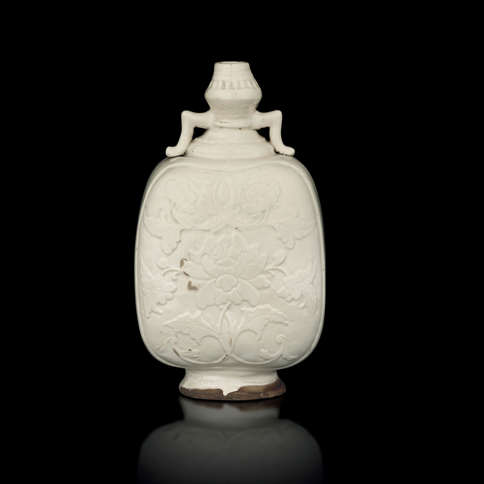 Rare stoneware ceramic moon flask, Guan, in Ding stila with relief flowers, China, Yuan/Ming Dynasty: Rare stoneware ceramic moon flask, Guan, in Ding stila with relief flowers, China, Yuan/Ming Dynasty. ????? ?/?