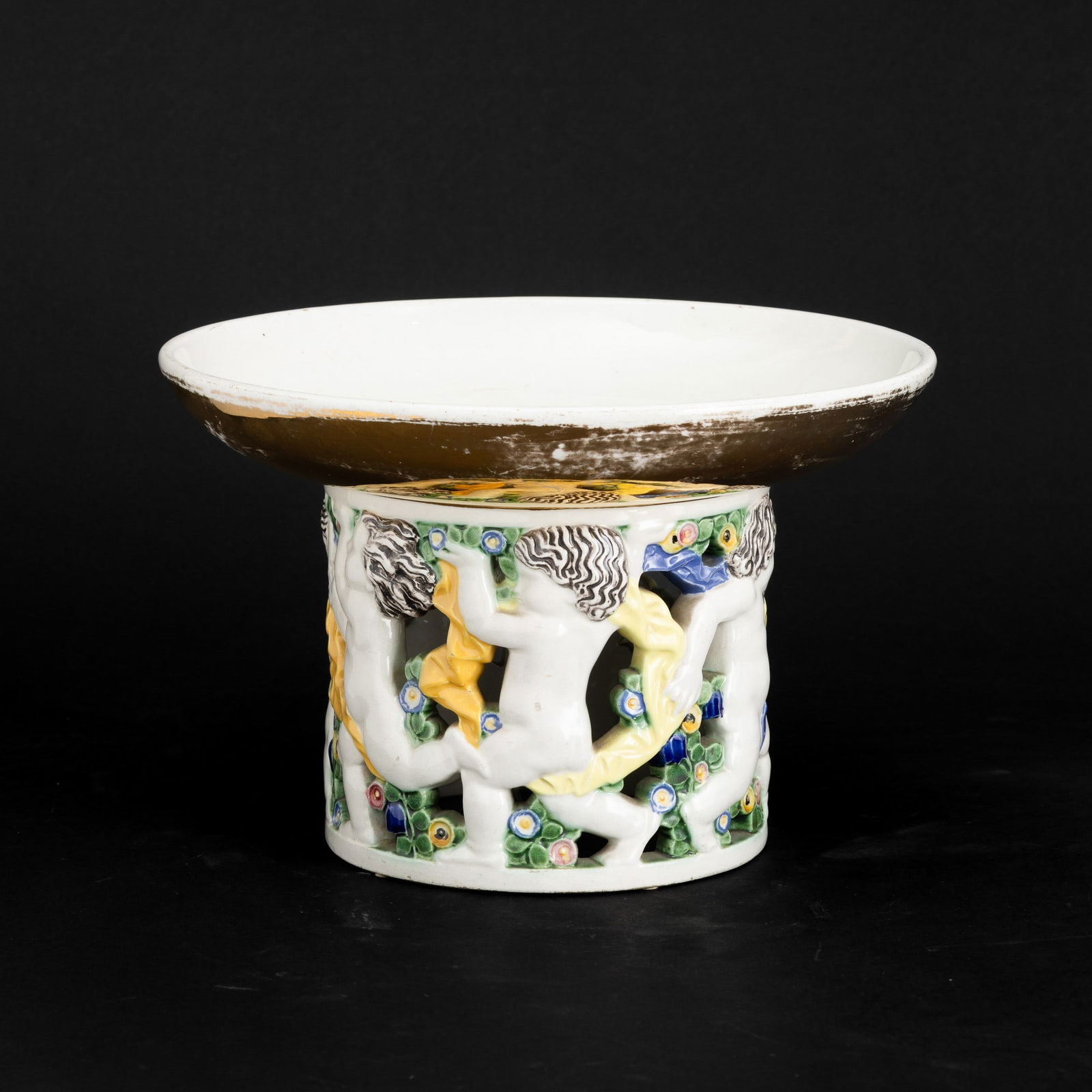 Michael Powolny 1871-1954 M. Powolny, Vienna 1910 ca: A slip-cast earthenware centrepiece with an embossed polychrome enamel decor. Stamped manufacturer's mark E. Frottier, Michael Powolny: Keramik und Glas aus Wien 1900 bis 1950, Vienna 1990, fig. 39, d